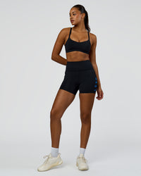 Woman wearing Rep Ultra High-Rise 4" Short Pockets - Black-Palace Blue | Model:Rosie | Size:S | Thumbnail Index: 2