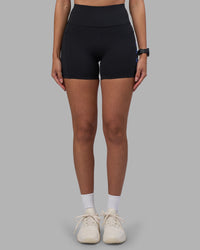 Woman wearing Rep Ultra High-Rise 4" Short Pockets - Black-Power Cobalt | Model:Rhiley | Size:S | Thumbnail Index: 6