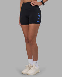 Woman wearing Rep Ultra High-Rise 4" Short Pockets - Black-Power Cobalt | Model:Rhiley | Size:S | Thumbnail Index: 0