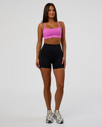 Woman wearing Rep Ultra High-Rise 4" Short Pockets - Black-Ultra Fuchsia | Model:Bianca | Size:S | Thumbnail Index: 2