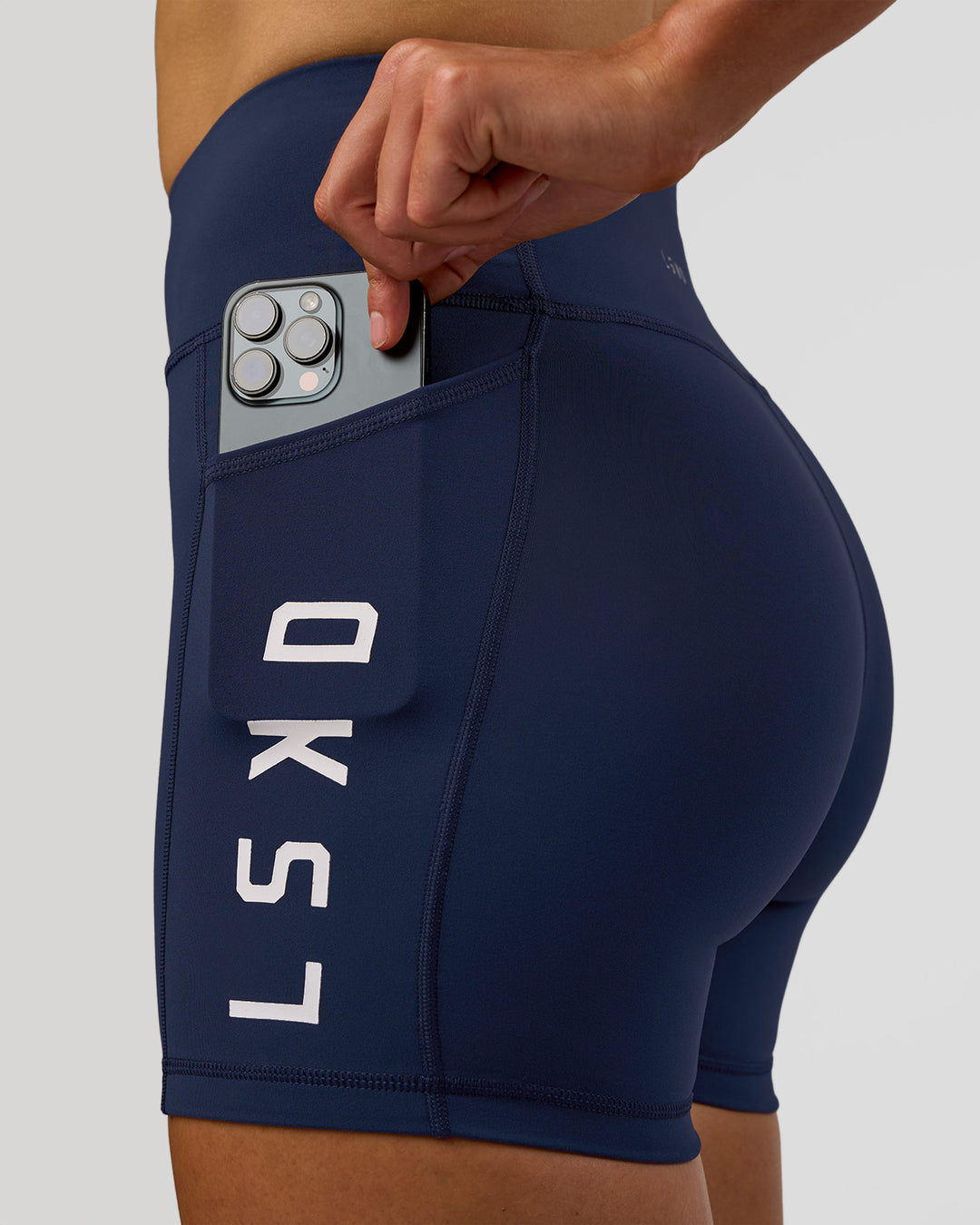 Woman wearing Rep Ultra High-Rise 4" Short Pockets - Future Navy-White | Model:Evie | Size:S - view 6