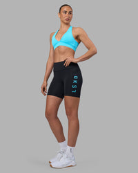 Woman wearing Rep Ultra High-Rise 6" Short Pockets - Black-Blue Atoll | Model:Sophie | Size:S | Thumbnail Index: 6