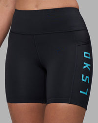 Woman wearing Rep Ultra High-Rise 6" Short Pockets - Black-Blue Atoll | Model:Sophie | Size:S | Thumbnail Index: 5