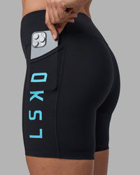 Woman wearing Rep Ultra High-Rise 6" Short Pockets - Black-Blue Atoll | Model:Sophie | Size:S | Thumbnail Index: 2