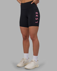 Woman wearing Rep Ultra High-Rise 6" Short Pockets - Black-Candy Pink | Model:Keisha | Size:S | Thumbnail Index: 2
