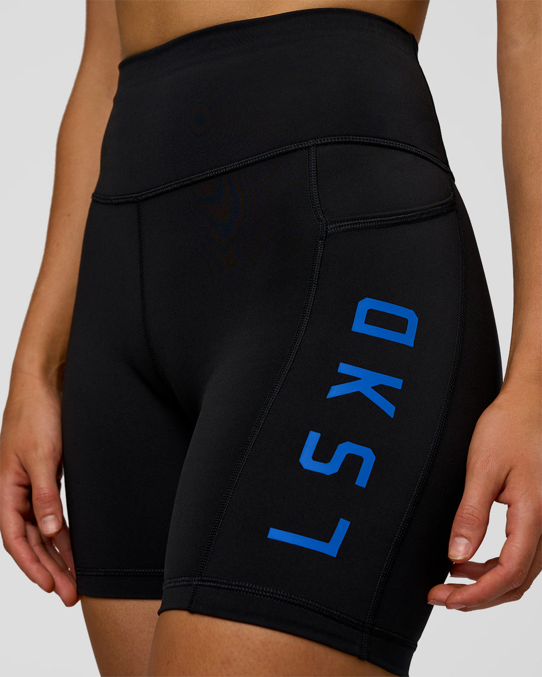 Woman wearing Rep Ultra High-Rise 6" Short Pockets - Black-Electric Indigo | Model:Evie | Size:S - view 6