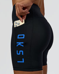 Woman wearing Rep Ultra High-Rise 6" Short Pockets - Black-Palace Blue | Model:Rosie | Size:S | Thumbnail Index: 0