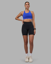 Woman wearing Rep Ultra High-Rise 6" Short Pockets - Black-Power Cobalt | Model:Rhiley | Size:S | Thumbnail Index: 4