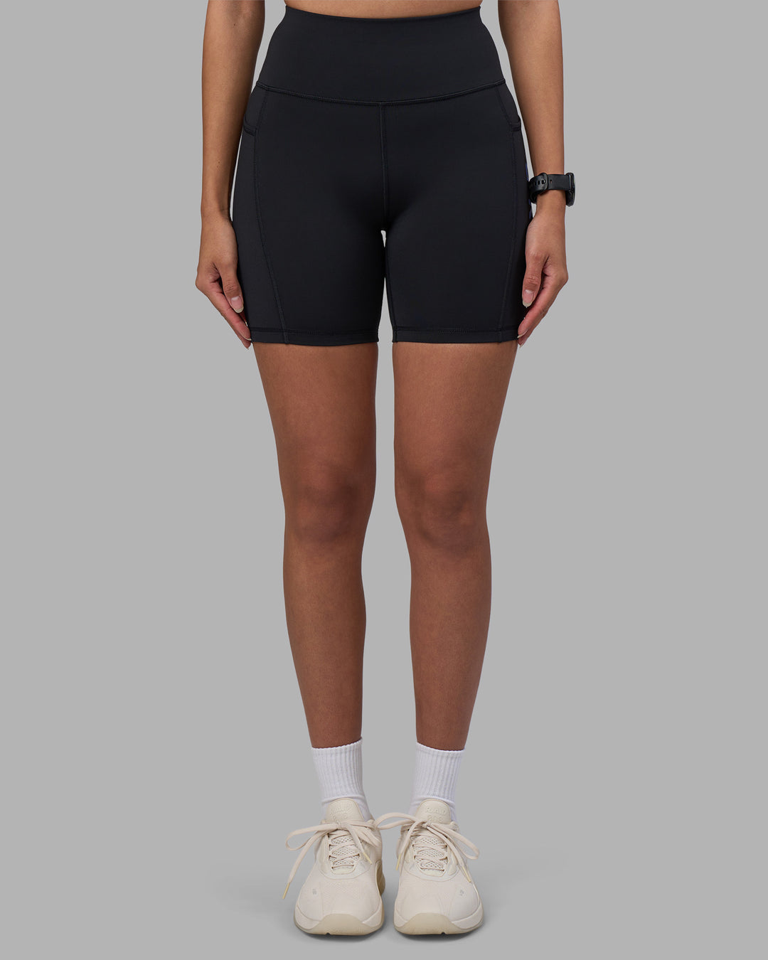 Woman wearing Rep Ultra High-Rise 6" Short Pockets - Black-Power Cobalt | Model:Rhiley | Size:S - view 3
