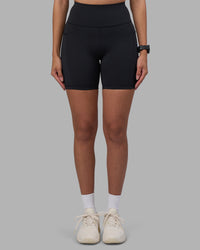 Woman wearing Rep Ultra High-Rise 6" Short Pockets - Black-Power Cobalt | Model:Rhiley | Size:S | Thumbnail Index: 2