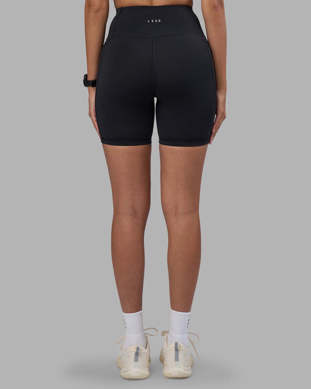 Woman wearing Rep Ultra High-Rise 6" Short Pockets - Black-Power Cobalt | Model:Rhiley | Size:S - view 4
