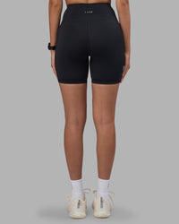 Woman wearing Rep Ultra High-Rise 6" Short Pockets - Black-Power Cobalt | Model:Rhiley | Size:S | Thumbnail Index: 3