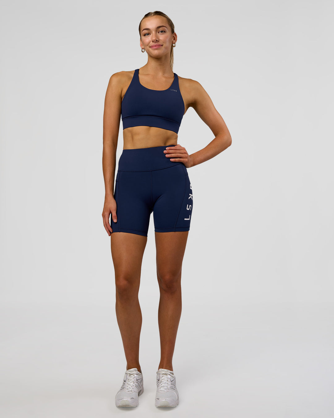 Woman wearing Rep Ultra High-Rise 6" Short Pockets - Future Navy-White | Model:Evie | Size:S - view 6
