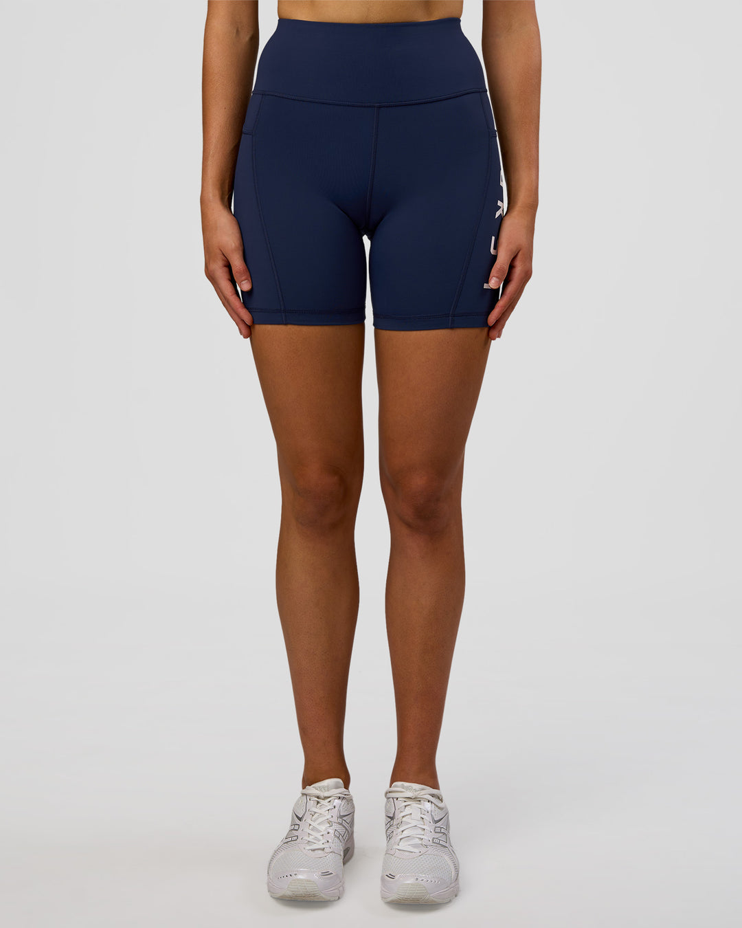Woman wearing Rep Ultra High-Rise 6" Short Pockets - Future Navy-White | Model:Evie | Size:S - view 7