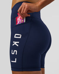 Woman wearing Rep Ultra High-Rise 6" Short Pockets - Future Navy-White | Model:Evie | Size:S | Thumbnail Index: 4