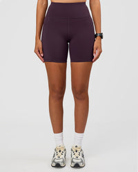 Woman wearing Rep Ultra High-Rise 6" Short Pockets - Midnight Plum-Marshmallow | Model:Rhiley | Size:S | Thumbnail Index: 2