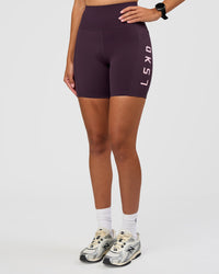 Woman wearing Rep Ultra High-Rise 6" Short Pockets - Midnight Plum-Marshmallow | Model:Rhiley | Size:S | Thumbnail Index: 7