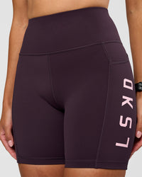 Woman wearing Rep Ultra High-Rise 6" Short Pockets - Midnight Plum-Marshmallow | Model:Rhiley | Size:S | Thumbnail Index: 6