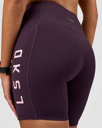 Woman wearing Rep Ultra High-Rise 6" Short Pockets - Midnight Plum-Marshmallow | Model:Rhiley | Size:S | Thumbnail Index: 1