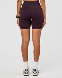Woman wearing Rep Ultra High-Rise 6" Short Pockets - Midnight Plum-Marshmallow | Model:Rhiley | Size:S | Thumbnail Index: 4