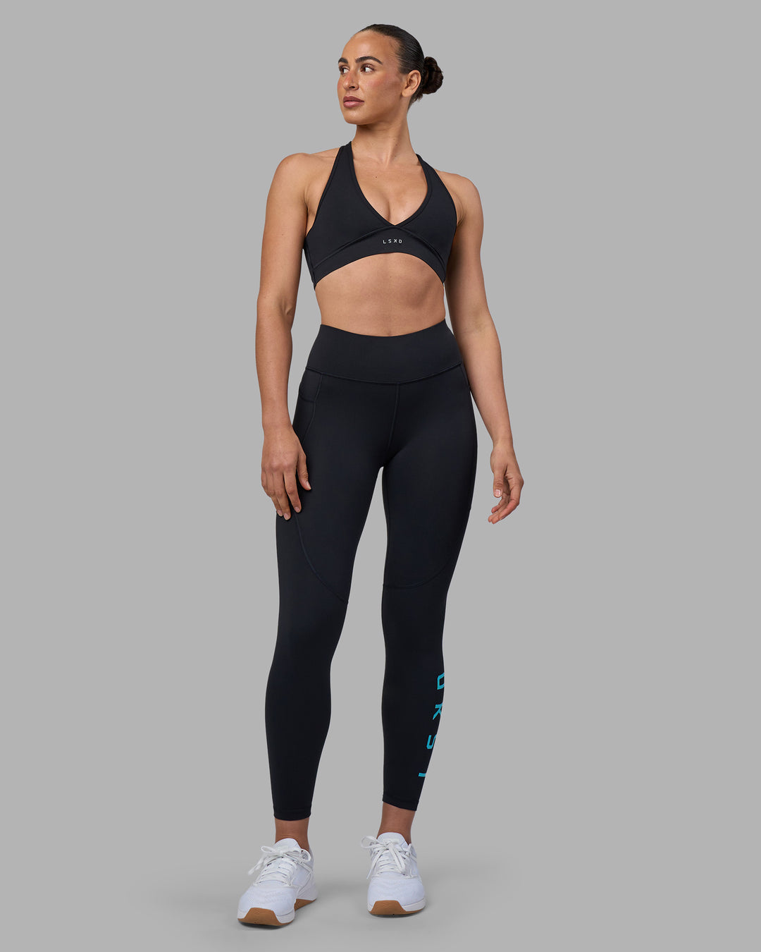 Woman wearing Rep Ultra High-Rise 7/8 Legging Pockets - Black-Blue Atoll | Model:Sophie | Size:S - view 1