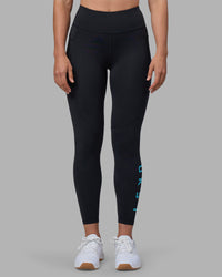 Woman wearing Rep Ultra High-Rise 7/8 Legging Pockets - Black-Blue Atoll | Model:Sophie | Size:S | Thumbnail Index: 6