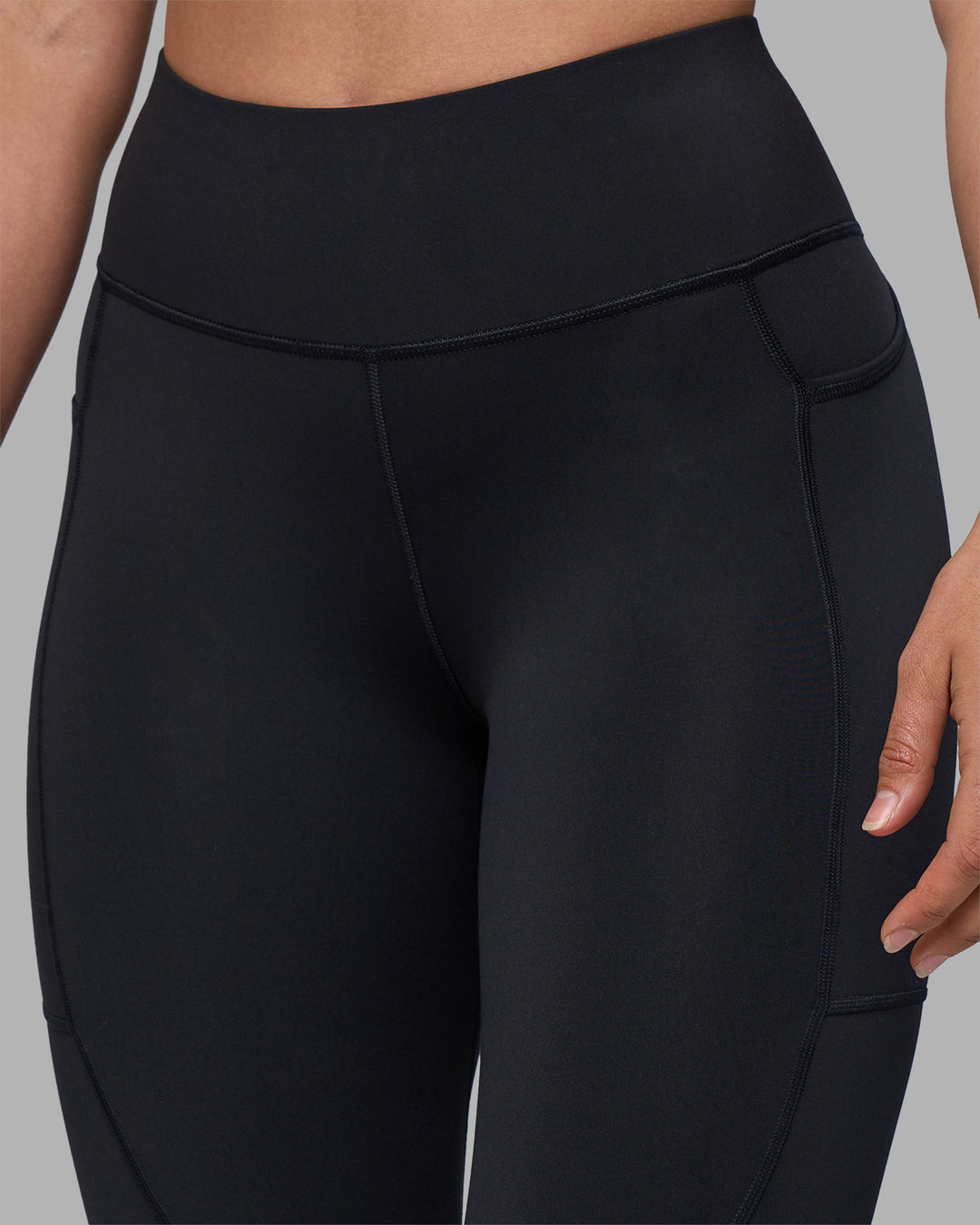 Woman wearing Rep Ultra High-Rise 7/8 Legging Pockets - Black-Blue Atoll | Model:Sophie | Size:S - view 8