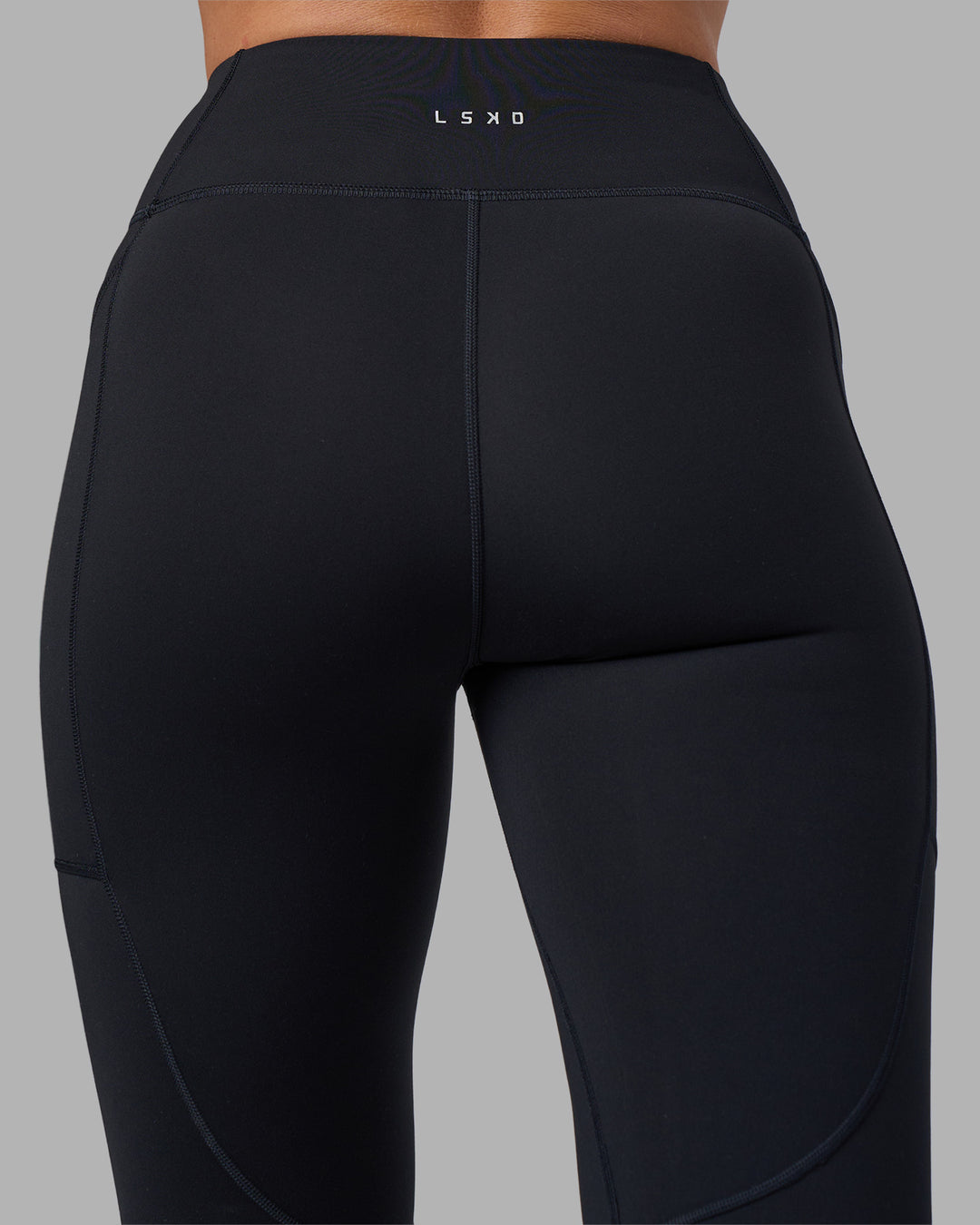 Woman wearing Rep Ultra High-Rise 7/8 Legging Pockets - Black-Blue Atoll | Model:Sophie | Size:S - view 9
