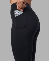 Woman wearing Rep Ultra High-Rise 7/8 Legging Pockets - Black-Blue Atoll | Model:Sophie | Size:S | Thumbnail Index: 5