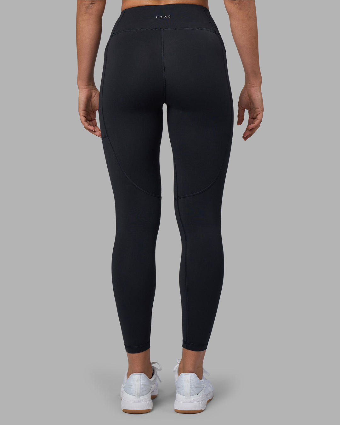 Woman wearing Rep Ultra High-Rise 7/8 Legging Pockets - Black-Blue Atoll | Model:Sophie | Size:S - view 4