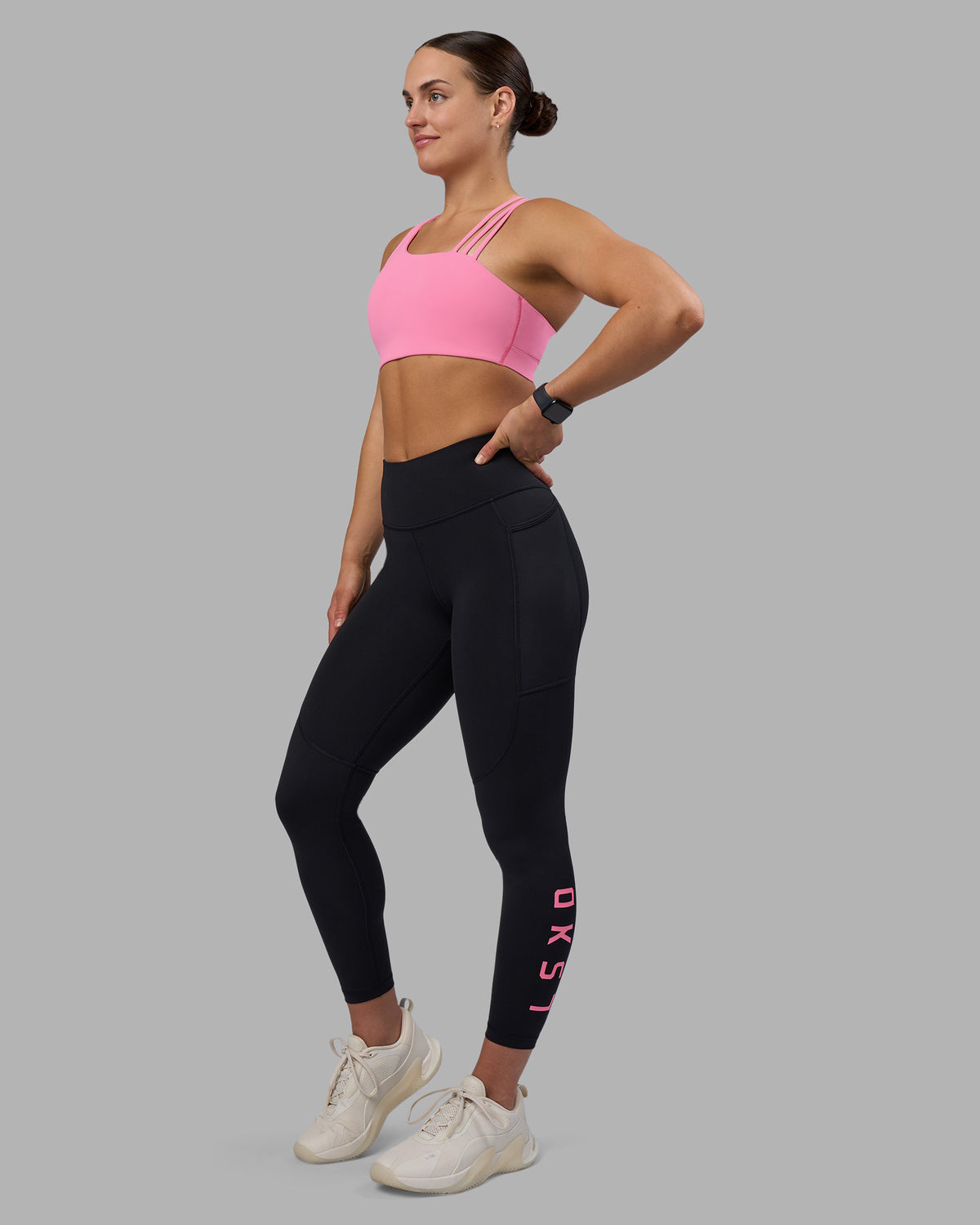 Woman wearing Rep Ultra High-Rise 7/8 Legging Pockets - Black-Candy Pink | Model:Keisha | Size:S