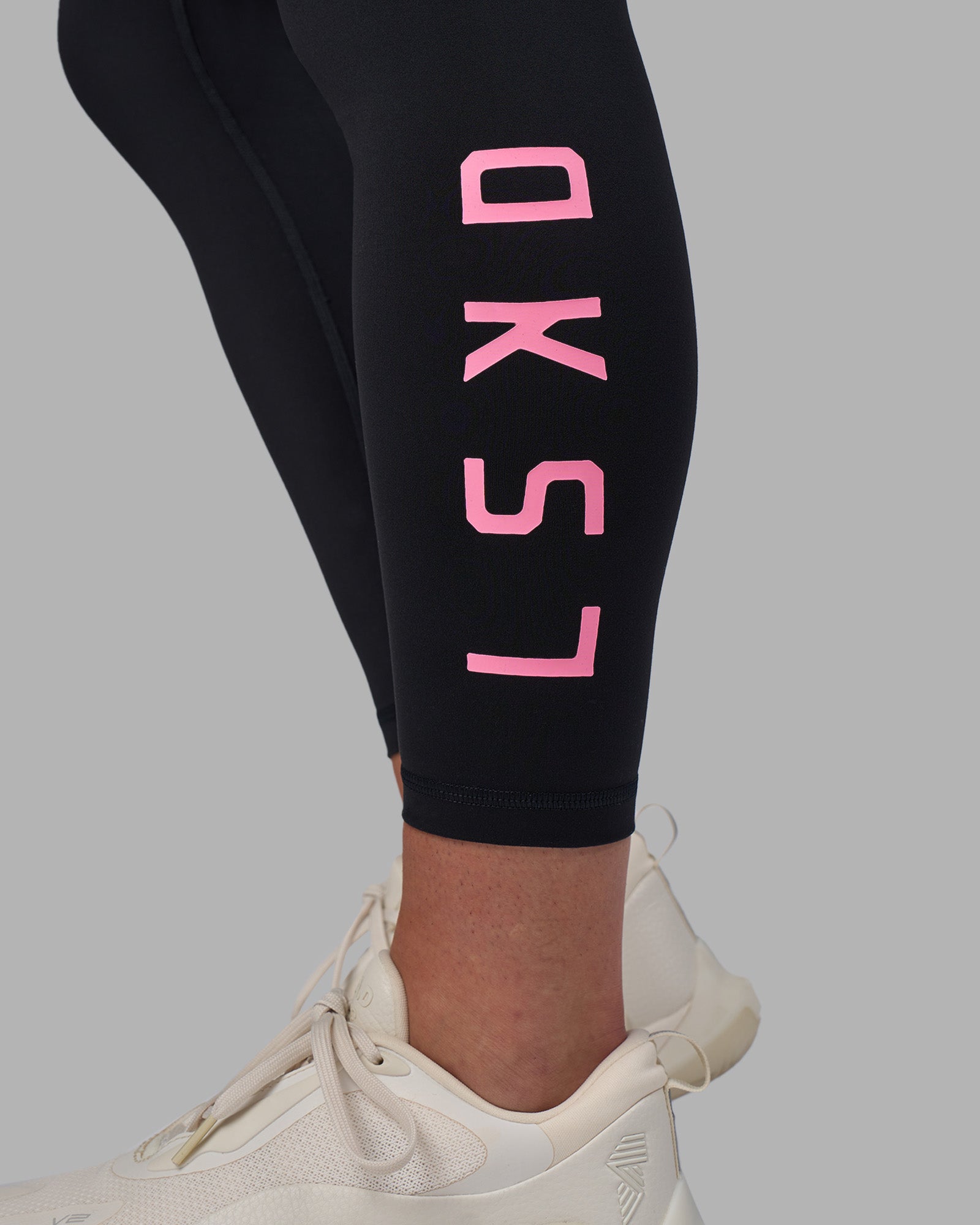 Woman wearing Rep Ultra High-Rise 7/8 Legging Pockets - Black-Candy Pink | Model:Keisha | Size:S