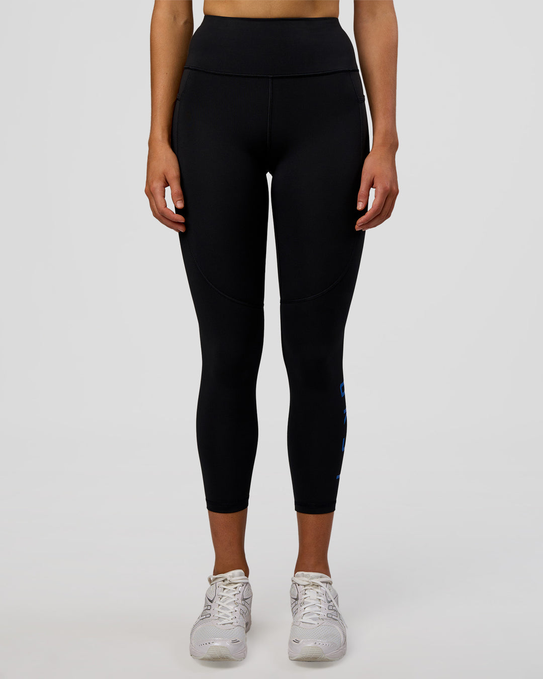 Woman wearing Rep Ultra High-Rise 7/8 Legging Pockets - Black-Electric Indigo | Model:Evie | Size:S - view 3