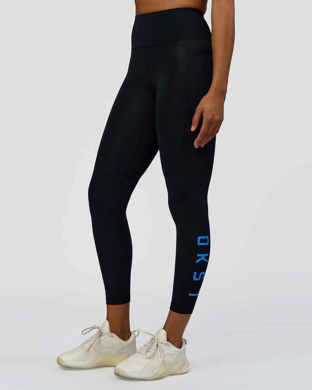 Woman wearing Rep Ultra High-Rise 7/8 Legging Pockets - Black-Palace Blue | Model:Rosie | Size:S - view 1