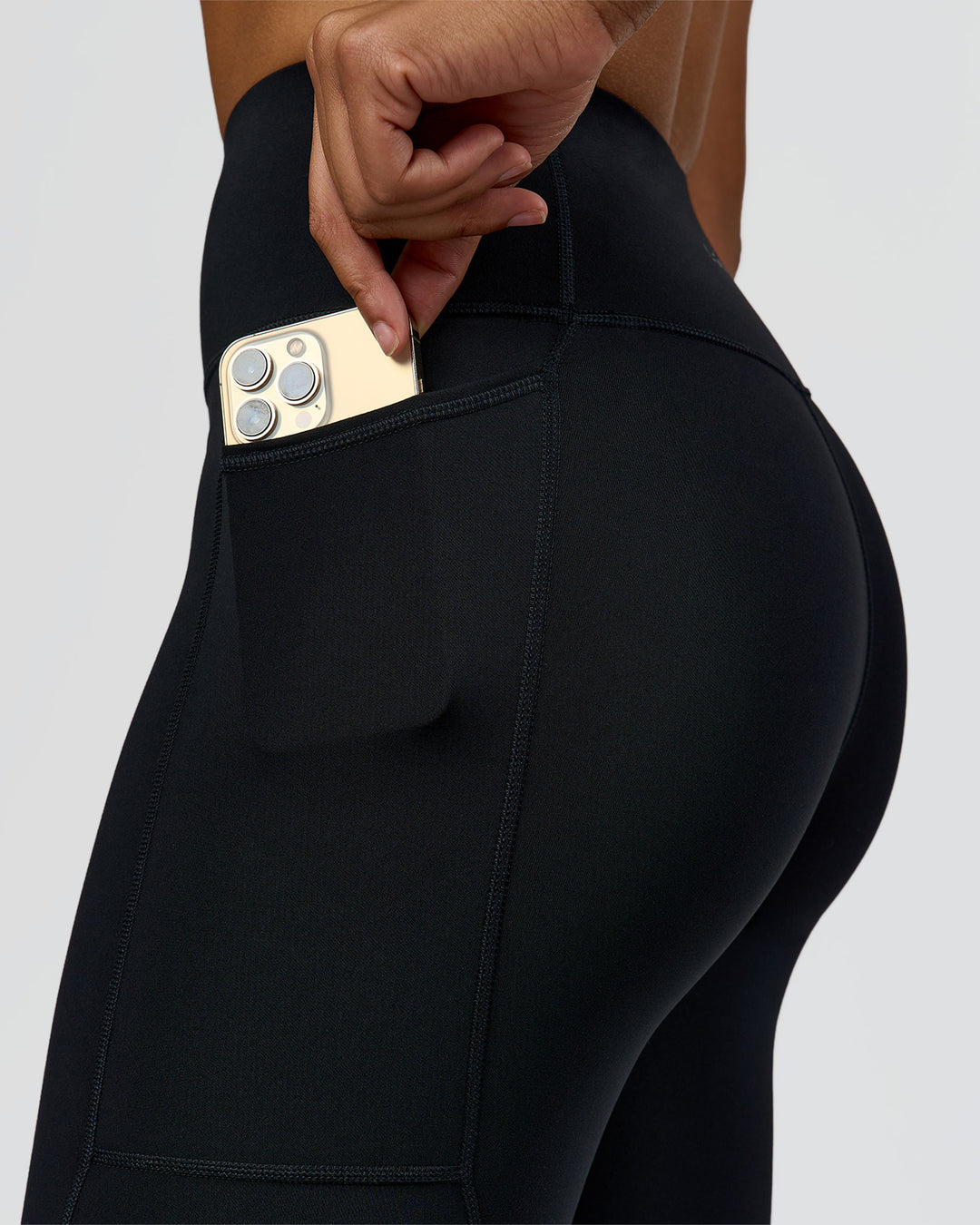 Woman wearing Rep Ultra High-Rise 7/8 Legging Pockets - Black-Palace Blue | Model:Rosie | Size:S - view 3