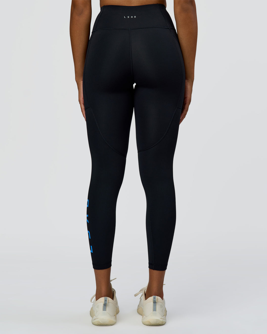 Woman wearing Rep Ultra High-Rise 7/8 Legging Pockets - Black-Palace Blue | Model:Rosie | Size:S - view 4