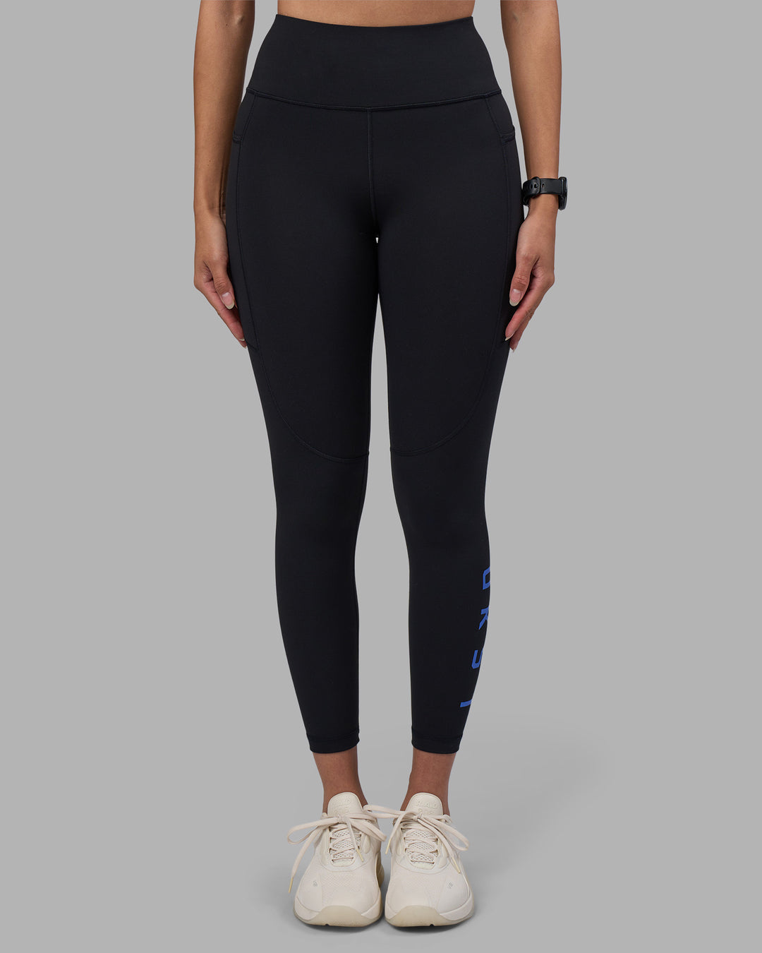 Woman wearing Rep Ultra High-Rise 7/8 Legging Pockets - Black-Power Cobalt | Model:Rhiley | Size:S - view 8