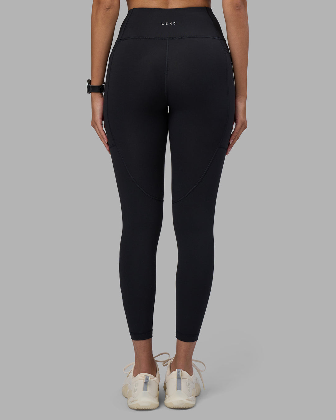 Woman wearing Rep Ultra High-Rise 7/8 Legging Pockets - Black-Power Cobalt | Model:Rhiley | Size:S - view 4