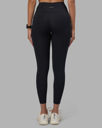 Woman wearing Rep Ultra High-Rise 7/8 Legging Pockets - Black-Power Cobalt | Model:Rhiley | Size:S | Thumbnail Index: 3
