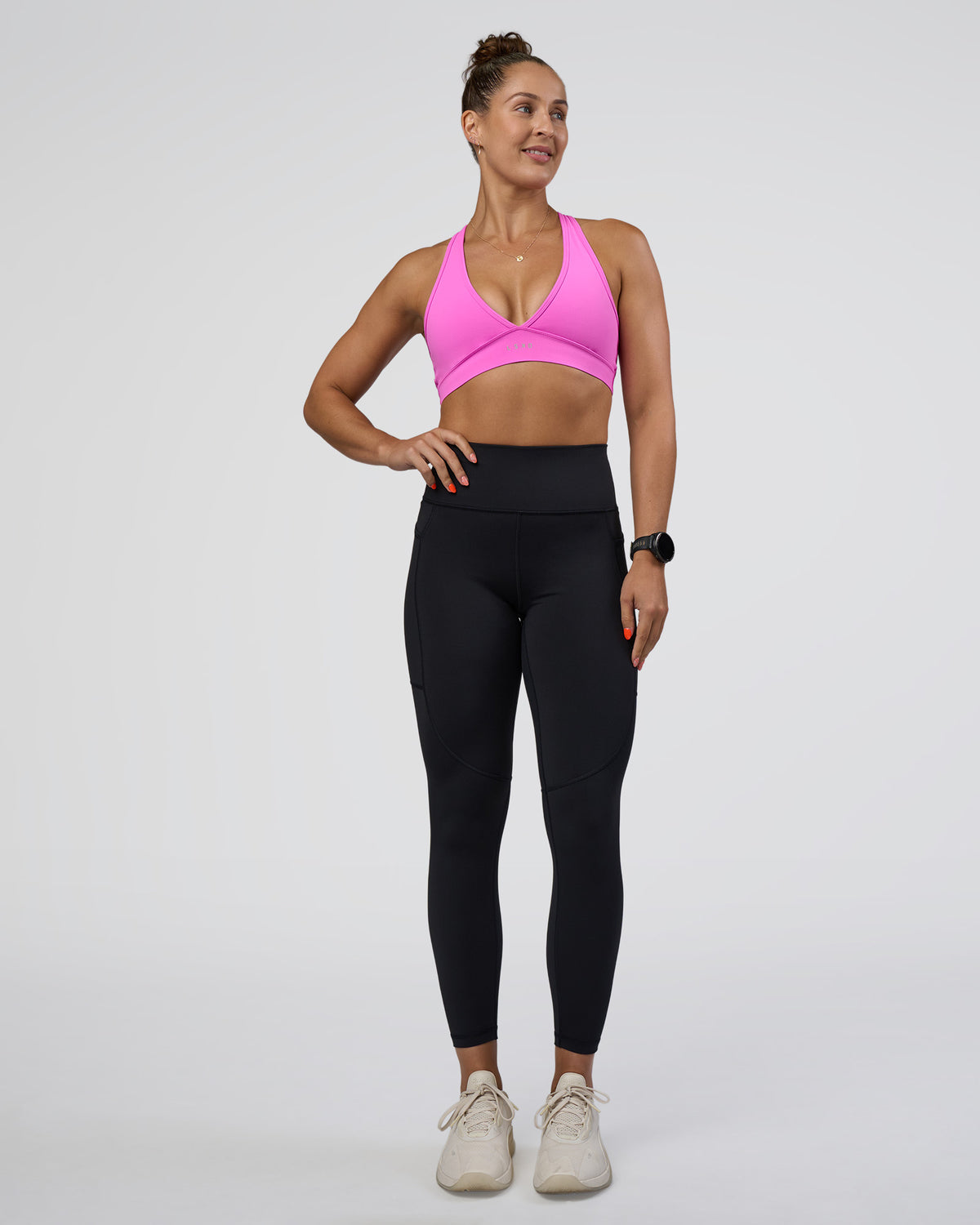 Woman wearing Rep Ultra High-Rise 7/8 Legging Pockets - Black-Ultra Fuchsia | Model:Abbey | Size:S