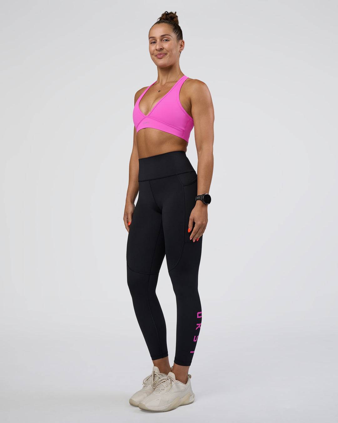 Woman wearing Rep Ultra High-Rise 7/8 Legging Pockets - Black-Ultra Fuchsia | Model:Abbey | Size:S - view 5
