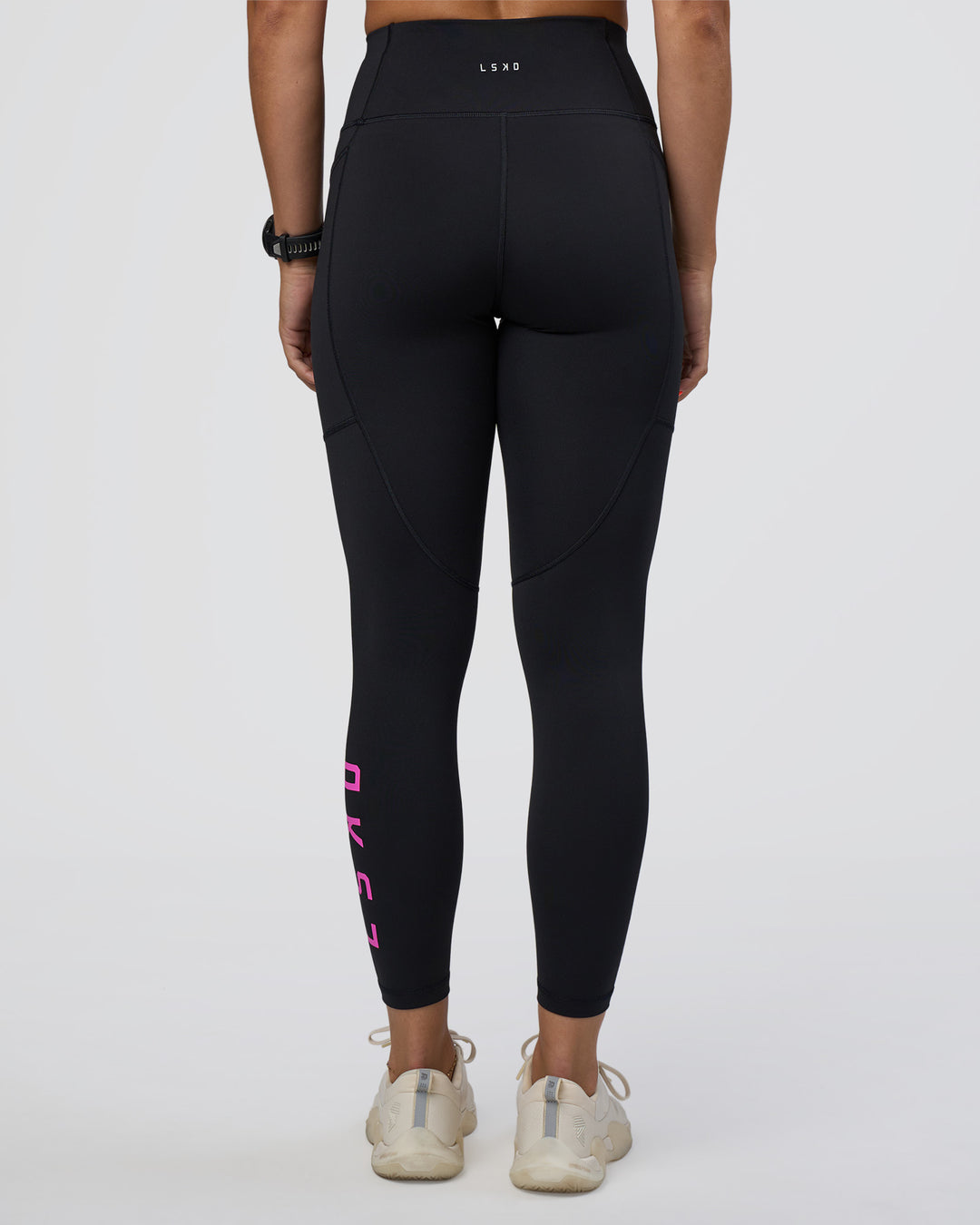 Woman wearing Rep Ultra High-Rise 7/8 Legging Pockets - Black-Ultra Fuchsia | Model:Abbey | Size:S - view 4
