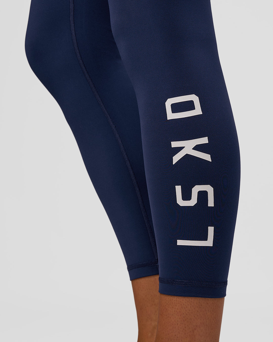 Woman wearing Rep Ultra High-Rise 7/8 Legging Pockets - Future Navy-White | Model:Evie | Size:S - view 3