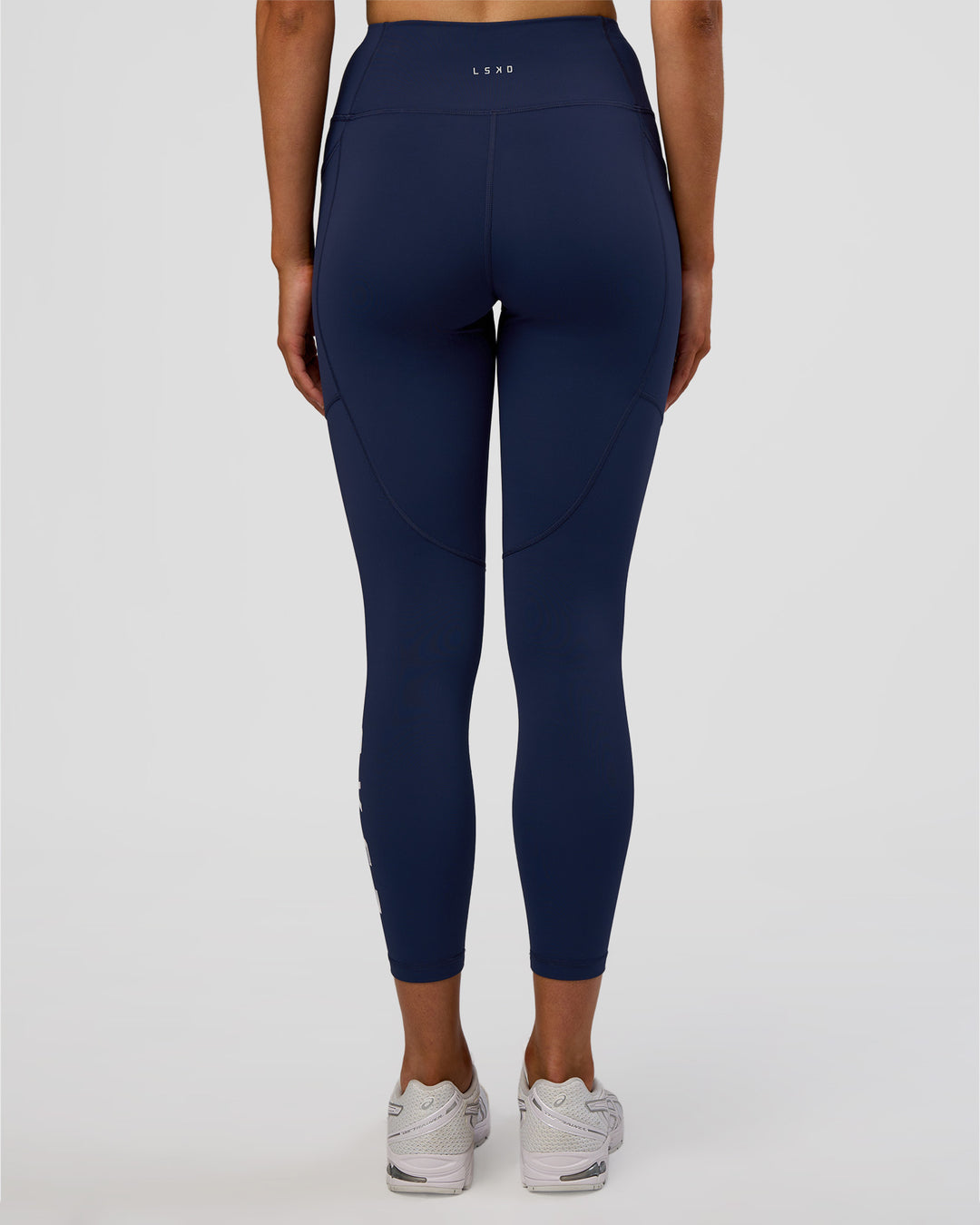 Woman wearing Rep Ultra High-Rise 7/8 Legging Pockets - Future Navy-White | Model:Evie | Size:S - view 4