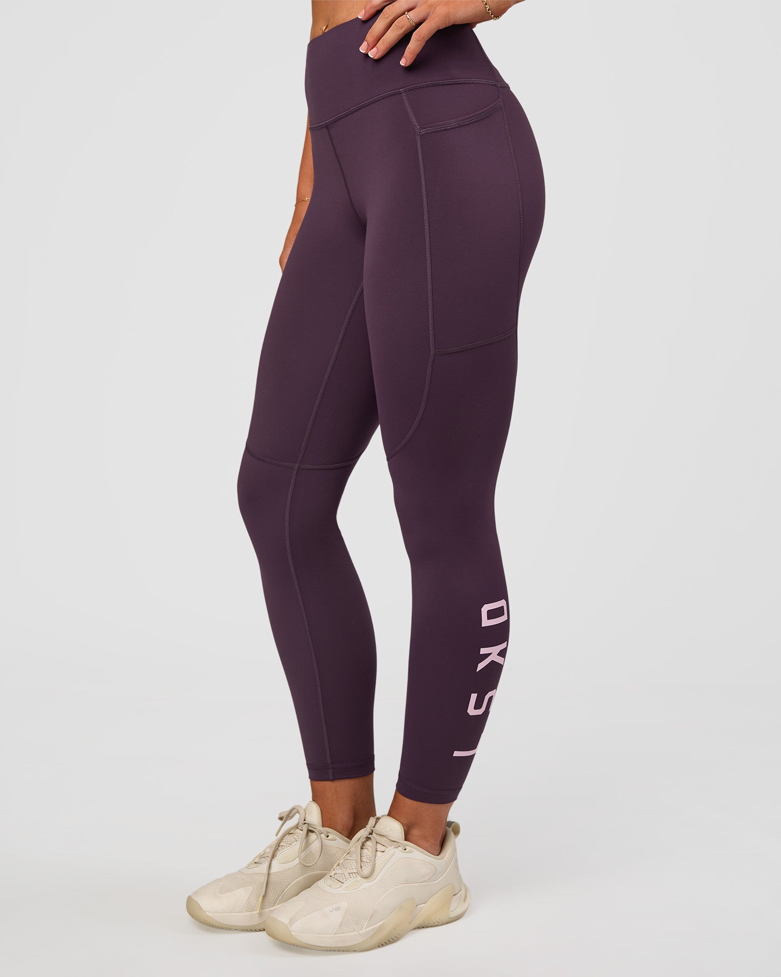 Woman wearing Rep Ultra High-Rise 7/8 Legging Pockets - Midnight Plum-Marshmallow | Model:Emelia | Size:S
