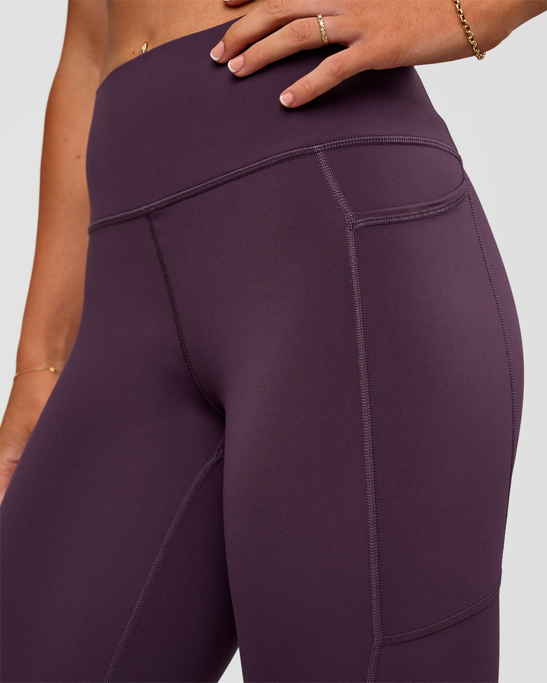 Woman wearing Rep Ultra High-Rise 7/8 Legging Pockets - Midnight Plum-Marshmallow | Model:Emelia | Size:S - view 8