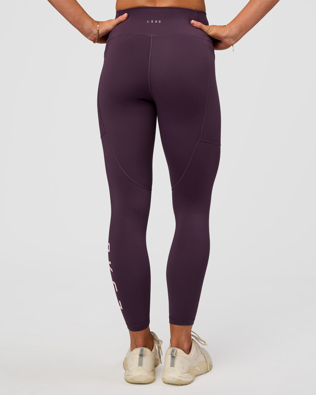 Woman wearing Rep Ultra High-Rise 7/8 Legging Pockets - Midnight Plum-Marshmallow | Model:Emelia | Size:S - view 6