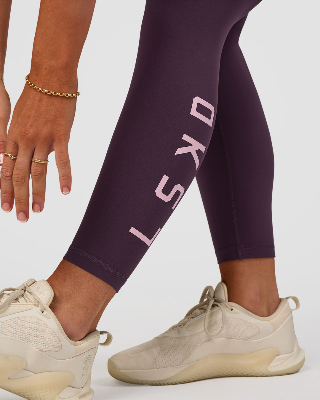 Woman wearing Rep Ultra High-Rise 7/8 Legging Pockets - Midnight Plum-Marshmallow | Model:Emelia | Size:S - view 4