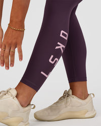 Woman wearing Rep Ultra High-Rise 7/8 Legging Pockets - Midnight Plum-Marshmallow | Model:Emelia | Size:S | Thumbnail Index: 3