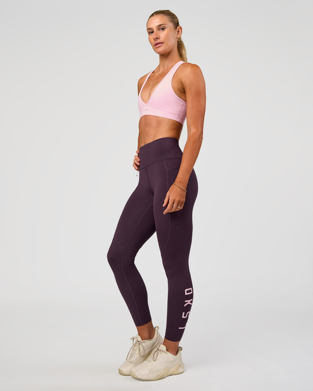 Woman wearing Rep Ultra High-Rise 7/8 Legging Pockets - Midnight Plum-Marshmallow | Model:Emelia | Size:S - view 1